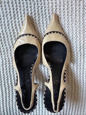 CHANEL Beige Leather Pointed Toe Slingback Heels with Black Trim